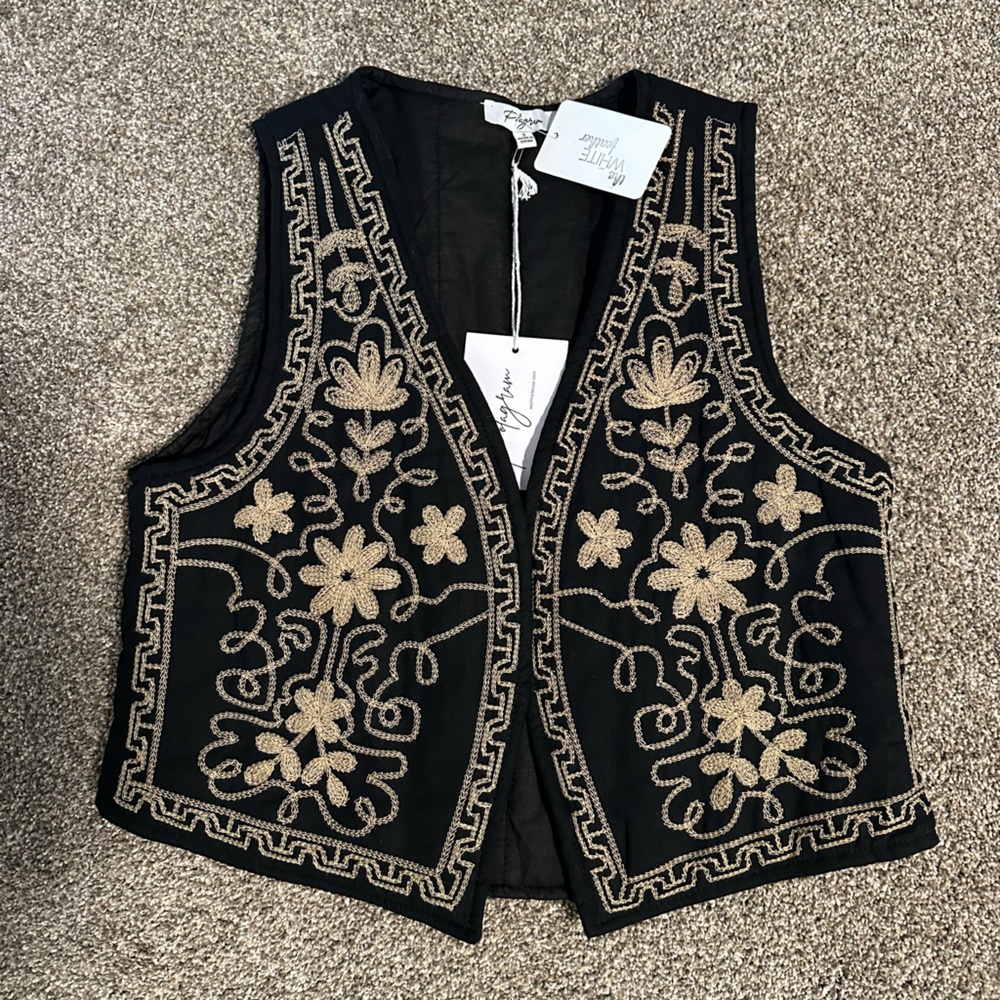 Black and gold stitched vest